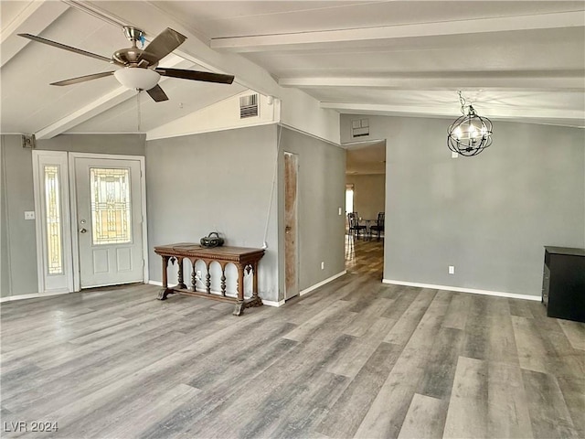 entrance foyer featuring vaulted ceiling with beams, hardwood / wood-style floors, and ceiling fan with notable chandelier