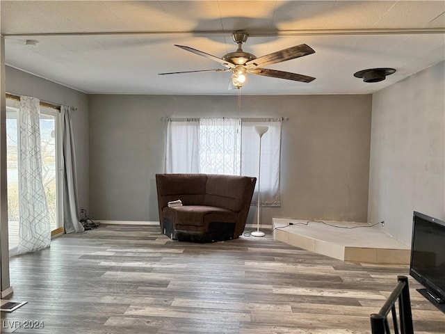 sitting room featuring ceiling fan and wood-type flooring