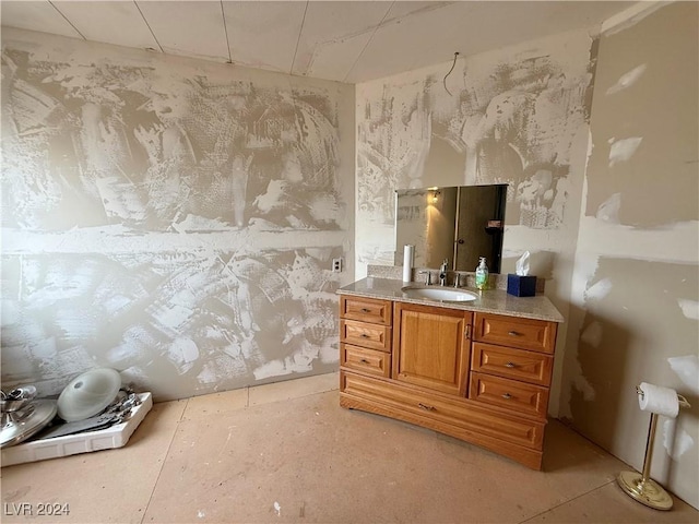 bathroom featuring vanity and concrete flooring