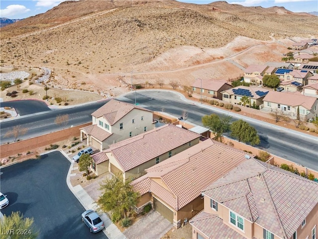 birds eye view of property with a mountain view