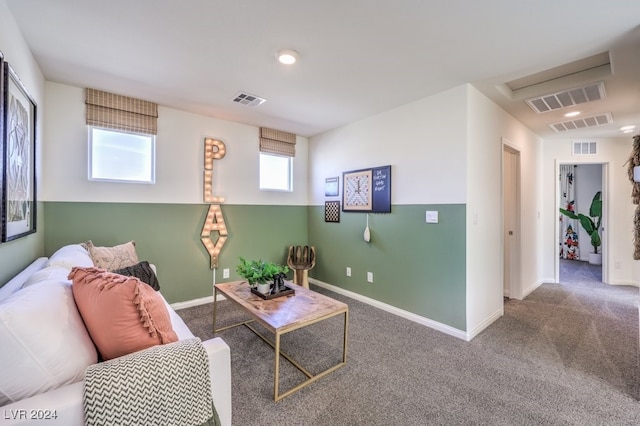 carpeted living room featuring plenty of natural light