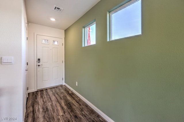 doorway with dark hardwood / wood-style flooring