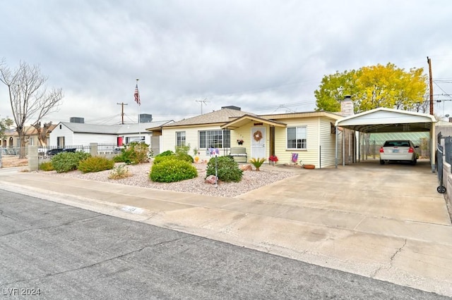 view of front of property featuring a carport