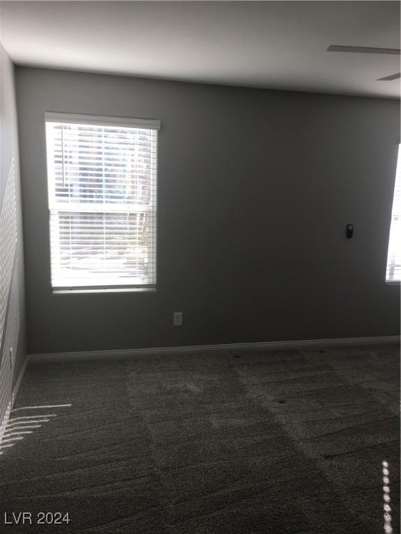 carpeted empty room with ceiling fan