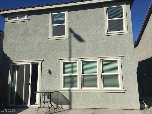 rear view of house featuring a patio area