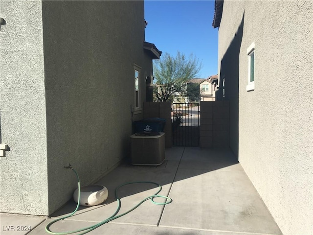 view of side of home featuring central AC