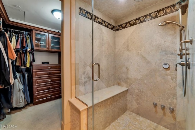 bathroom with a shower with shower door