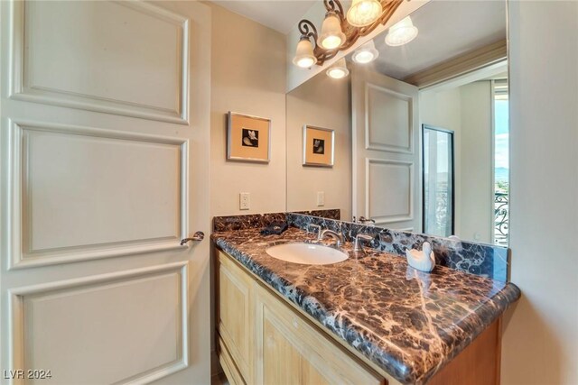 bathroom featuring vanity and an inviting chandelier