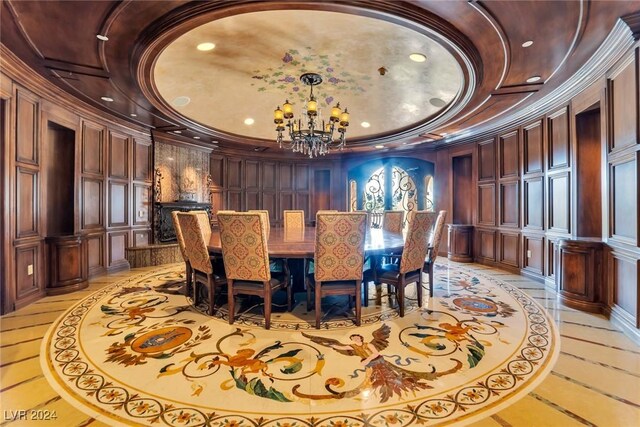 dining area with crown molding and a notable chandelier