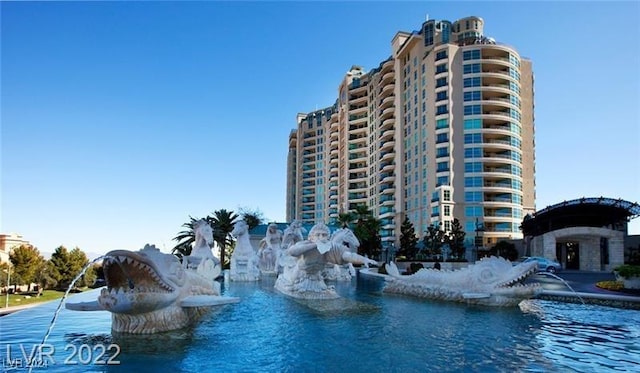 view of swimming pool featuring a water view