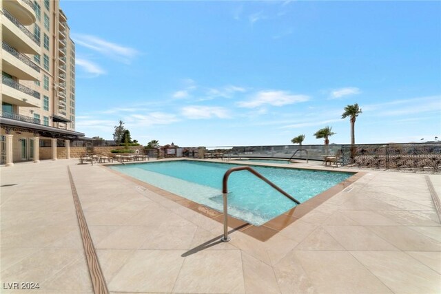 view of swimming pool featuring a patio area