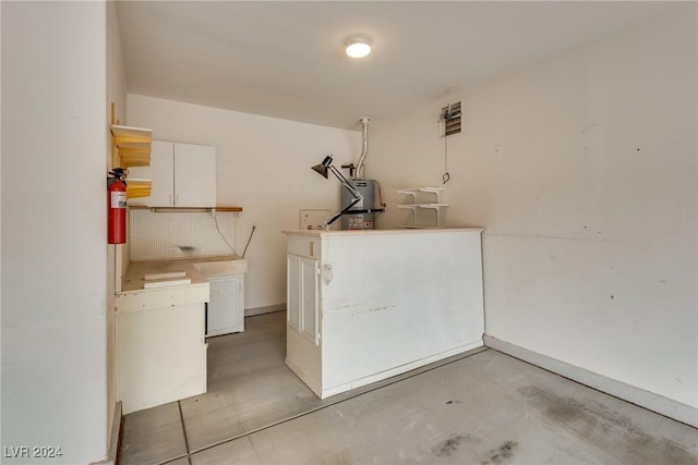 laundry area featuring water heater