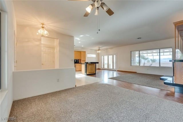 spare room featuring ceiling fan and light hardwood / wood-style flooring