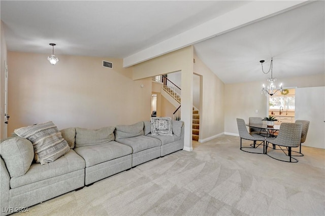 living room featuring a notable chandelier, light carpet, and vaulted ceiling