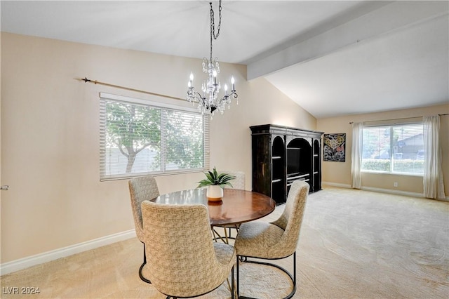 dining room with lofted ceiling with beams, light colored carpet, and an inviting chandelier