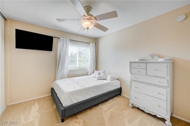 bedroom featuring ceiling fan and light colored carpet