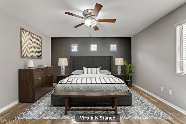 bedroom with hardwood / wood-style floors and ceiling fan