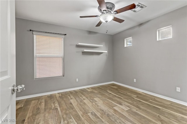 unfurnished room featuring ceiling fan and light hardwood / wood-style floors