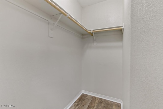 walk in closet featuring hardwood / wood-style floors