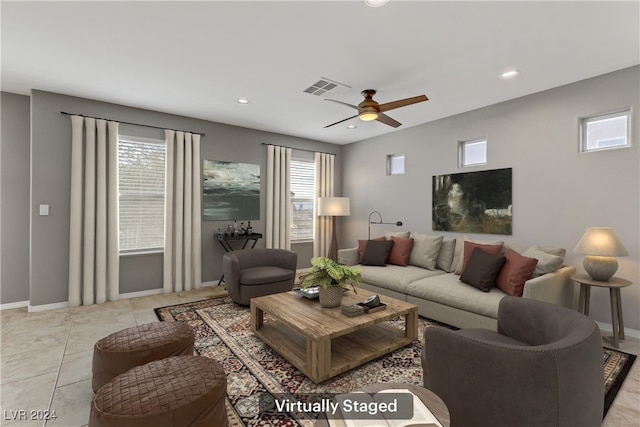 living room with ceiling fan and light tile patterned floors