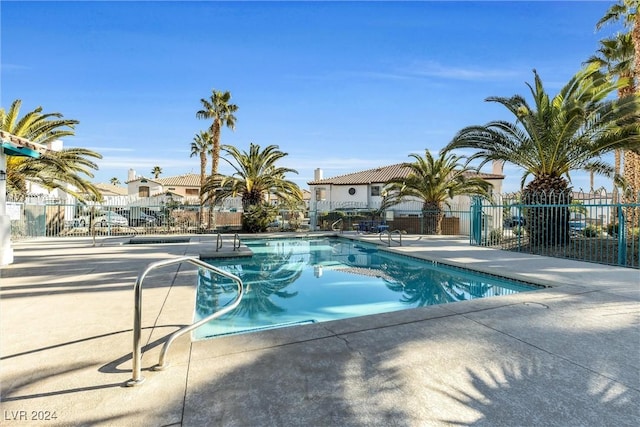 view of swimming pool with a patio area