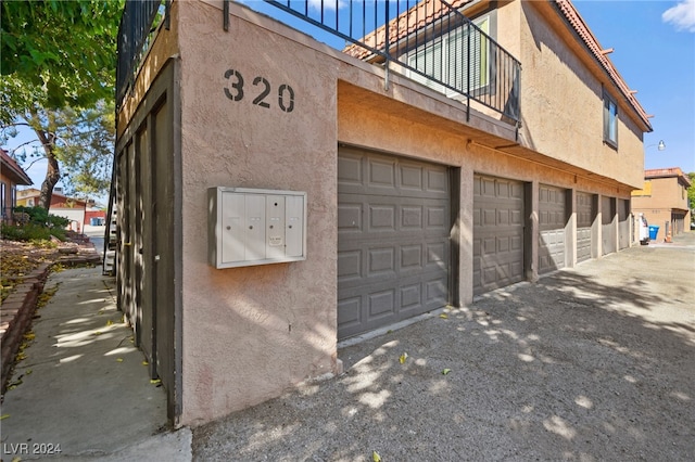 view of property exterior with a garage