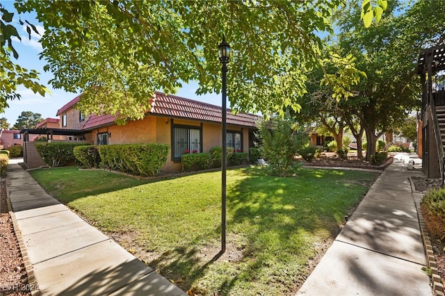 view of front facade featuring a front yard