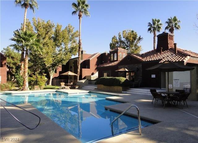 view of pool featuring a patio area