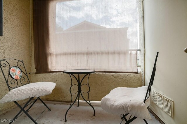 living area featuring concrete floors