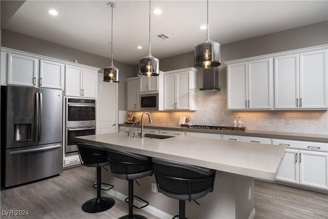 kitchen with sink, stainless steel appliances, and white cabinetry