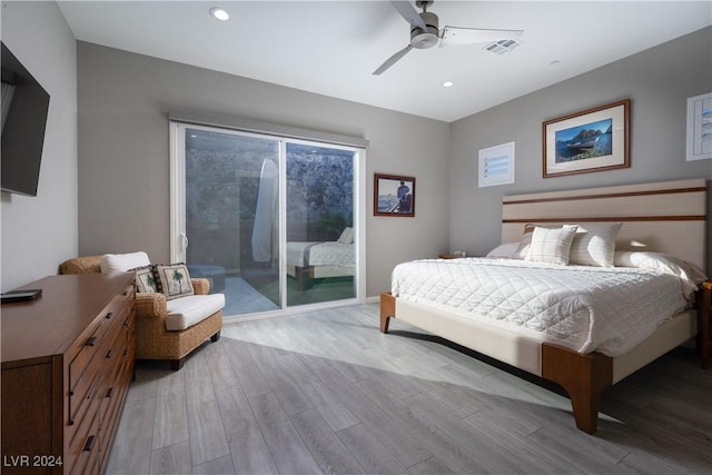 bedroom featuring ceiling fan, light hardwood / wood-style floors, and access to outside