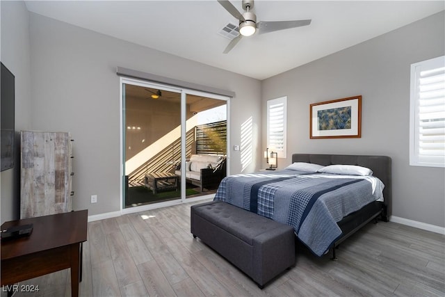 bedroom with ceiling fan, light wood-type flooring, and access to outside