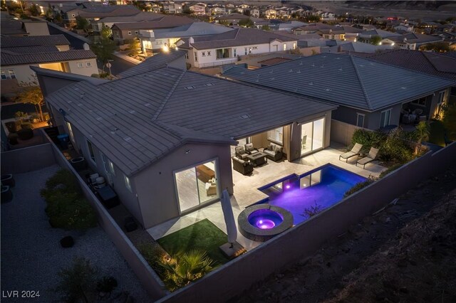 view of pool with an in ground hot tub, outdoor lounge area, and a patio