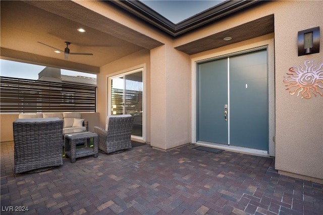 view of patio featuring ceiling fan