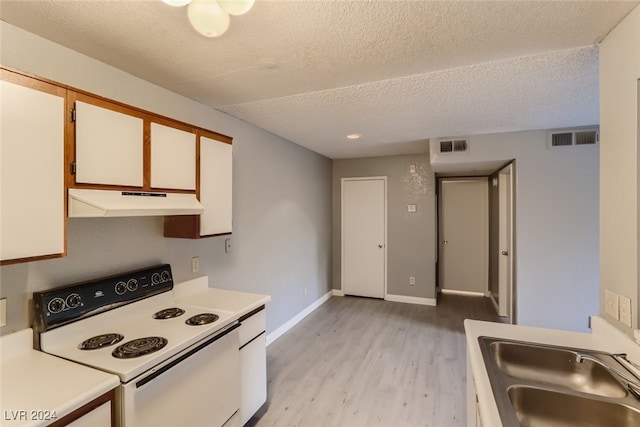 kitchen with light wood-type flooring, a textured ceiling, sink, white electric range, and white cabinetry