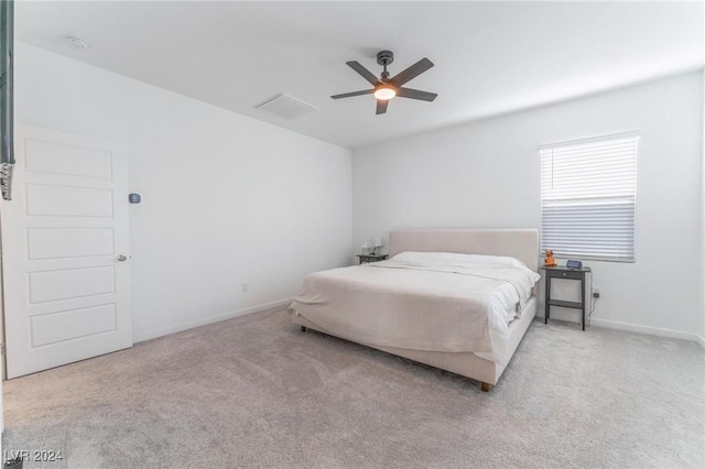 bedroom featuring ceiling fan and light colored carpet