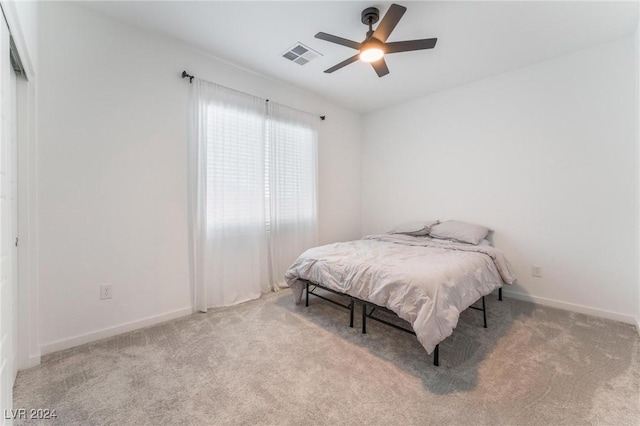 carpeted bedroom with ceiling fan