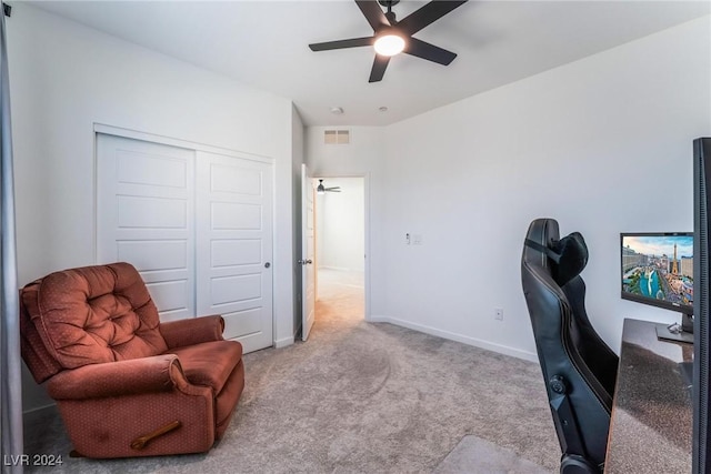 office area featuring ceiling fan and light colored carpet