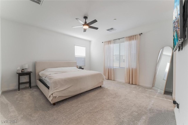 bedroom featuring ceiling fan and light colored carpet