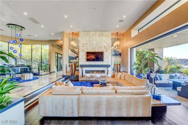 living room featuring a large fireplace and dark wood-type flooring