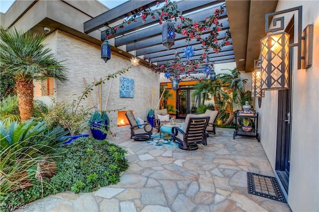 view of patio with a pergola and outdoor lounge area