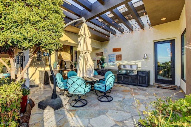 view of patio with a pergola, area for grilling, and a grill