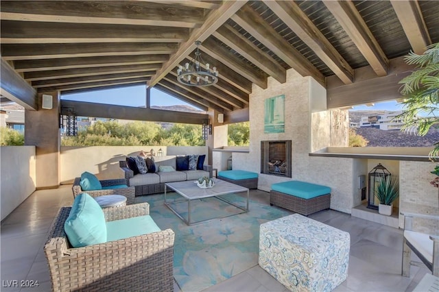 view of patio featuring an outdoor living space with a fireplace