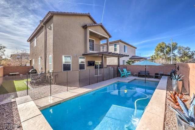 view of swimming pool with a fenced in pool, a fenced backyard, and a patio