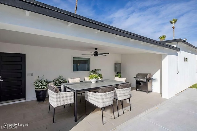 view of patio with area for grilling and ceiling fan