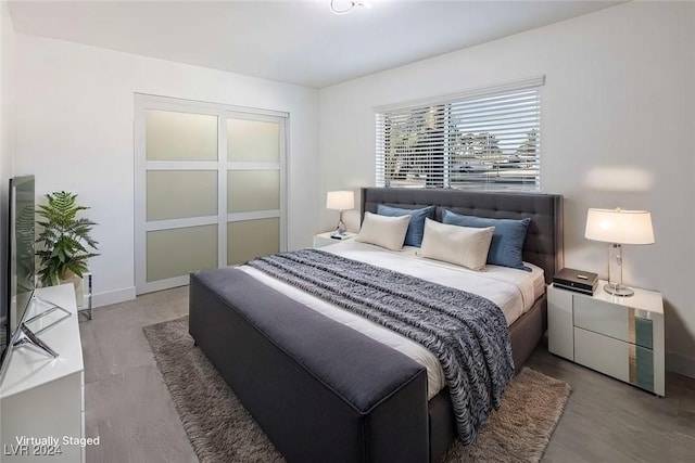 bedroom with hardwood / wood-style floors