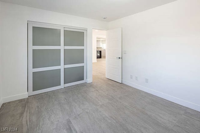 empty room with wood-type flooring