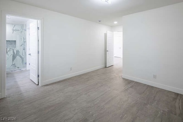 empty room with wood-type flooring