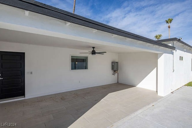 view of patio / terrace featuring a carport and ceiling fan