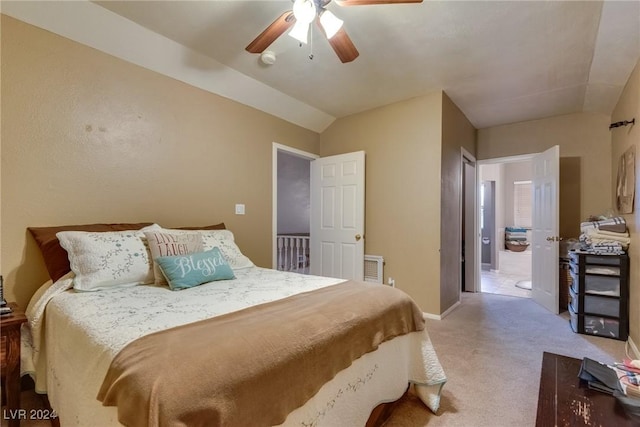 bedroom featuring a ceiling fan, lofted ceiling, light carpet, and baseboards